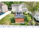 Aerial view of backyard featuring shed, patio, and lush lawn, perfect for outdoor living at 18027 Train Station Dr, Cornelius, NC 28031