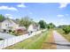 Serene backyard with lush greenery and a walking trail, offering a tranquil outdoor escape at 18027 Train Station Dr, Cornelius, NC 28031