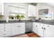 Bright kitchen with stainless steel appliances, granite countertops, and white cabinets at 18027 Train Station Dr, Cornelius, NC 28031