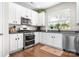 Well-lit kitchen with stainless steel appliances, granite countertops, and ample storage space at 18027 Train Station Dr, Cornelius, NC 28031