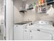 Well-equipped laundry room features modern machines and ample storage for convenient chore management at 18027 Train Station Dr, Cornelius, NC 28031