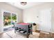 Bright room with sliding glass doors leading to an outdoor patio, with a multi-game table and a ceiling fan at 18027 Train Station Dr, Cornelius, NC 28031