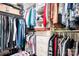 Organized walk-in closet with shelves, drawers, and hanging rods, perfect for clothing and accessory storage at 18027 Train Station Dr, Cornelius, NC 28031