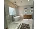 Stylish bathroom with walk-in shower, modern bathtub, and wooden vanity at 19409 Laurel Glen Ave, Cornelius, NC 28031