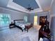Spacious main bedroom with trey ceiling, carpet, and ample natural light at 19409 Laurel Glen Ave, Cornelius, NC 28031