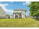 Backyard featuring canopy covered seating, a grill, and a lawn at 217 Almora Loop, Mooresville, NC 28115