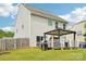 Backyard featuring canopy covered seating, a grill, and a lawn at 217 Almora Loop, Mooresville, NC 28115