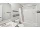 This bathroom features a bathtub and shower combination, complete with a mirror, providing functionality and style at 217 Almora Loop, Mooresville, NC 28115