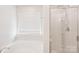 Bright bathroom features a tub, standup shower, and window with natural light for a relaxing atmosphere at 217 Almora Loop, Mooresville, NC 28115