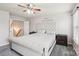 Comfortable bedroom featuring a plush bed, soft carpet, and bright windows, perfect for relaxation at 217 Almora Loop, Mooresville, NC 28115