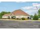 Community clubhouse with well manicured landscaping and American flag at 217 Almora Loop, Mooresville, NC 28115