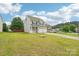 Charming two-story home with a manicured lawn and long driveway at 217 Almora Loop, Mooresville, NC 28115
