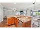 Kitchen featuring granite countertops, stainless steel appliances, and backyard view at 217 Almora Loop, Mooresville, NC 28115