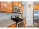 Kitchen showcasing stainless steel appliances and granite countertops at 217 Almora Loop, Mooresville, NC 28115