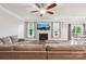 Comfortable living room with fireplace, ceiling fan and backyard access at 217 Almora Loop, Mooresville, NC 28115