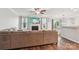 Cozy living room with a fireplace, large sectional sofa, and natural lighting at 217 Almora Loop, Mooresville, NC 28115