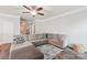 Spacious living room with large sectional sofa and wood flooring at 217 Almora Loop, Mooresville, NC 28115