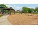 Neighborhood playground area with slides, swings, benches, and wood chip ground cover at 217 Almora Loop, Mooresville, NC 28115