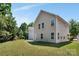 Large backyard with mature trees surrounding the home at 2751 Bramble Ridge Ct, Charlotte, NC 28215