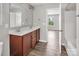 Stylish bathroom features a double sink vanity, a large mirror, and modern fixtures at 2751 Bramble Ridge Ct, Charlotte, NC 28215