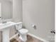Bathroom featuring a pedestal sink, toilet, and neutral paint at 2751 Bramble Ridge Ct, Charlotte, NC 28215