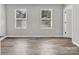 Inviting bedroom with two windows, providing natural light and a tranquil atmosphere at 2751 Bramble Ridge Ct, Charlotte, NC 28215