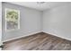 This bedroom features a bright window and is the perfect space for relaxation at 2751 Bramble Ridge Ct, Charlotte, NC 28215