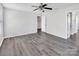 Neutral bedroom with ceiling fan, natural light, and ensuite bathroom at 2751 Bramble Ridge Ct, Charlotte, NC 28215