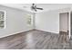 Bedroom with hardwood floors, natural light from window, and neutral paint at 2751 Bramble Ridge Ct, Charlotte, NC 28215