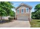 Charming two-story home boasts a two-car garage, well-manicured landscaping, and curb appeal at 2751 Bramble Ridge Ct, Charlotte, NC 28215