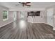 Open living room with hardwood flooring and a view to the kitchen at 2751 Bramble Ridge Ct, Charlotte, NC 28215