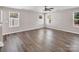 Spacious living room with large windows allowing plenty of natural light at 2751 Bramble Ridge Ct, Charlotte, NC 28215