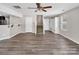 Large open living room with hardwood flooring and access to stairs and kitchen at 2751 Bramble Ridge Ct, Charlotte, NC 28215