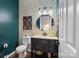 Stylish powder room with bold wallpaper, a modern vanity, and dark blue accent wall at 3134 Old Chapel Ln, Charlotte, NC 28210