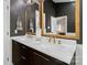 Stylish bathroom featuring a dual-sink vanity with marble countertops and framed mirrors with modern fixtures at 3134 Old Chapel Ln, Charlotte, NC 28210
