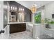 Elegant bathroom featuring a modern vanity with dual sinks, a freestanding tub, and a glass-enclosed shower at 3134 Old Chapel Ln, Charlotte, NC 28210