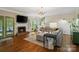 Cozy living room with a fireplace, hardwood floors, and a comfortable sectional sofa at 3134 Old Chapel Ln, Charlotte, NC 28210