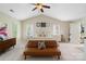 Inviting main bedroom featuring vaulted ceilings, plush carpeting, and a comfortable seating area with natural light at 3134 Old Chapel Ln, Charlotte, NC 28210