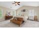 Cozy main bedroom with vaulted ceilings, plush carpeting, and abundant natural light from multiple windows at 3134 Old Chapel Ln, Charlotte, NC 28210