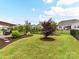 Spacious backyard featuring manicured lawns, mature trees, landscaping, a patio area, and privacy fencing at 3333 Oliver Stanley Trl, Lancaster, SC 29720