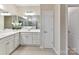Bright bathroom with a double sink vanity, large mirrors, and a neutral color palette at 3333 Oliver Stanley Trl, Lancaster, SC 29720