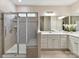 Bright bathroom featuring a glass enclosed shower, double sink vanity, and large mirrors at 3333 Oliver Stanley Trl, Lancaster, SC 29720