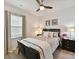 Cozy bedroom with a queen bed, neutral decor, and natural light from the window at 3333 Oliver Stanley Trl, Lancaster, SC 29720