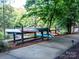 Multiple canoes are neatly stacked on a rack near a lake, perfect for outdoor water adventures at 3333 Oliver Stanley Trl, Lancaster, SC 29720