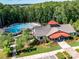Stunning aerial view of the community clubhouse, pool, landscaping, and surrounding trees at 3333 Oliver Stanley Trl, Lancaster, SC 29720