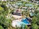 Aerial view showcasing the community clubhouse, pool, tennis courts, and well-maintained landscaping at 3333 Oliver Stanley Trl, Lancaster, SC 29720