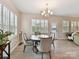 Bright dining area with plantation shutters, chandelier and neutral decor at 3333 Oliver Stanley Trl, Lancaster, SC 29720