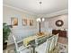 Formal dining room with a glass table, plush rug, stylish decor and plenty of light at 3333 Oliver Stanley Trl, Lancaster, SC 29720