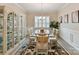 Formal dining room with a glass table, plush rug, and plenty of natural light at 3333 Oliver Stanley Trl, Lancaster, SC 29720