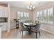 Dining area with chandelier, plantation shutters and neutral paint at 3333 Oliver Stanley Trl, Lancaster, SC 29720